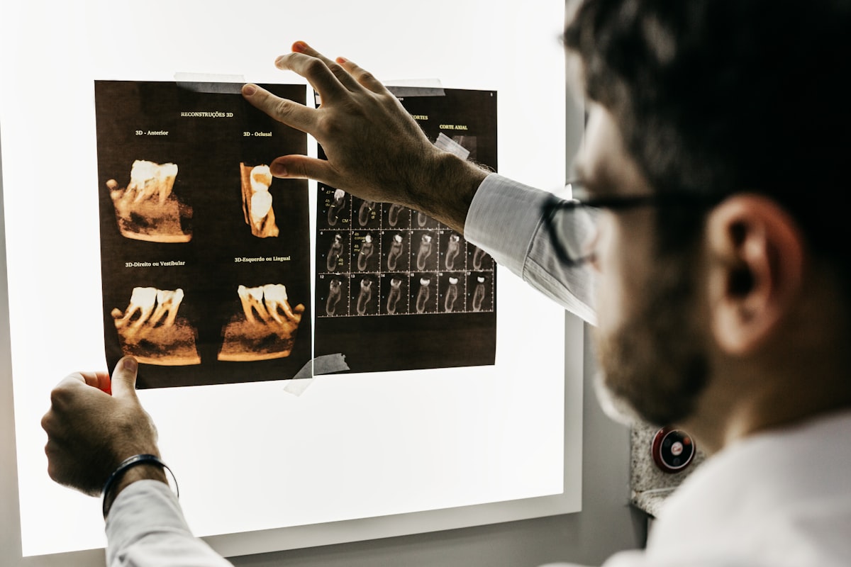 A dentist treating a smiling patient in a modern clinical setting